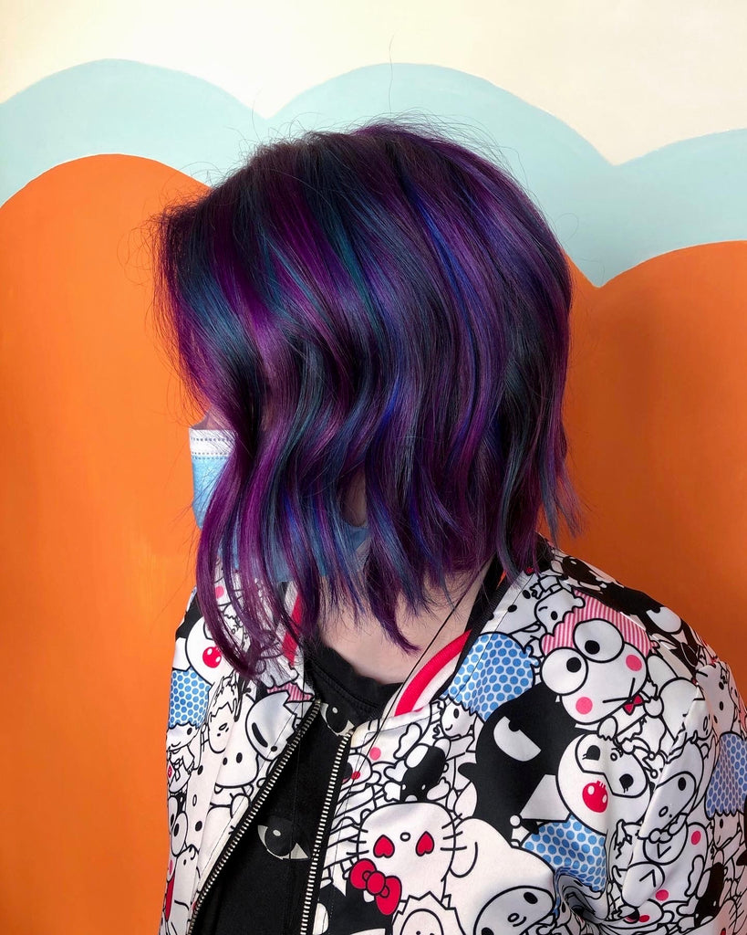 Hair model with blue and purple hair done by stylist Allister