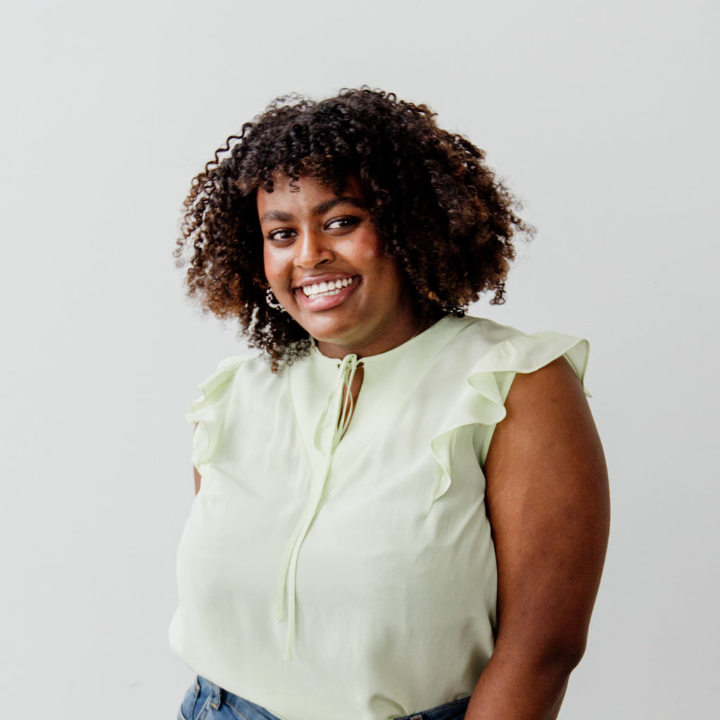 Smiling model with curly hair